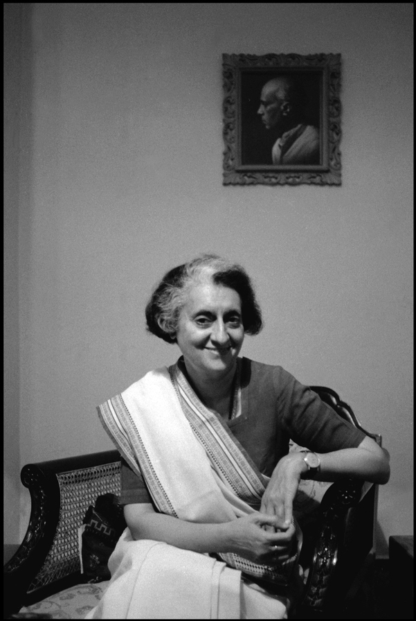 Indira Gandhi in her Safdarjung Road residence and a portrait of her father Jawaharlal Nehru, New Delhi, 1979