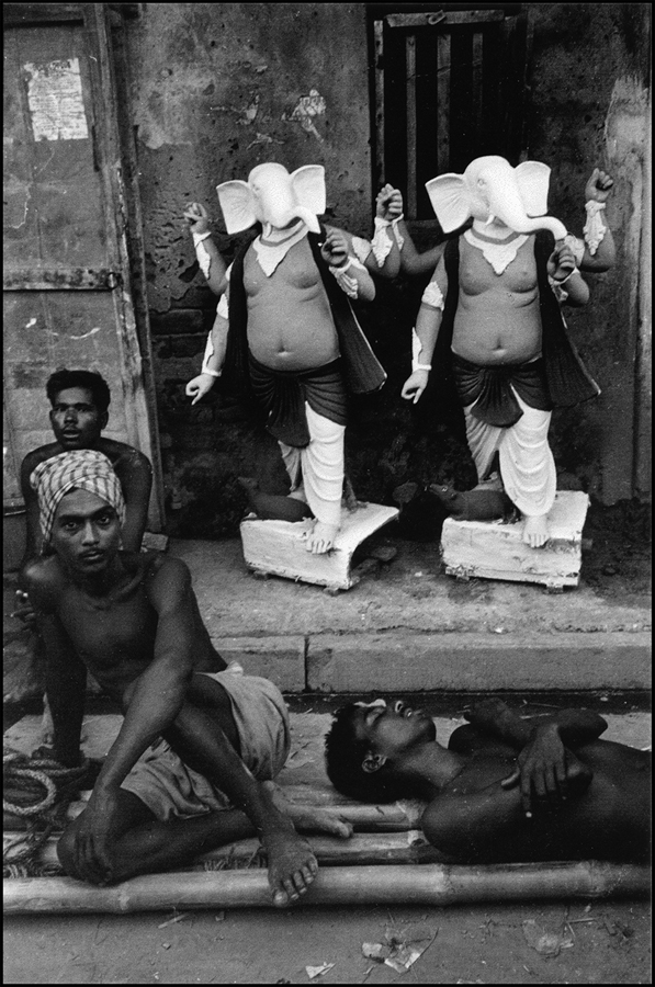 Men resting and Ganesh images, Calcutta, 1972