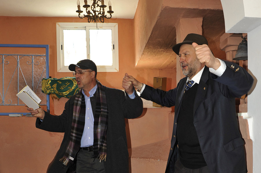 Mr. Jacky Kadoch and a pilgrim from Chicago singing Psalms before the tomb of the great saint Rabbi David u-Moshe (16th century), village of Agoïm, 2012