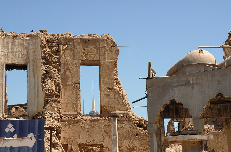 Kuwait Towers seen through a house destroyed during the 1990 Iraq-Kuwait war, 2008