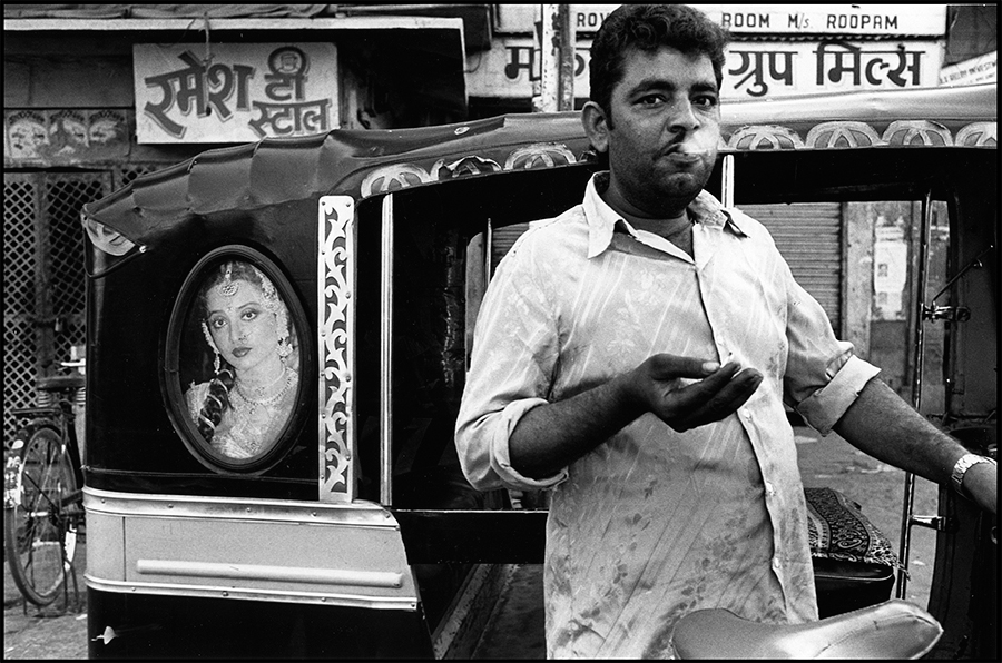 Image of Bollywood star, Rekha, on an autorickshaw and a passerby, Jodhpur, Rajasthan, 1988