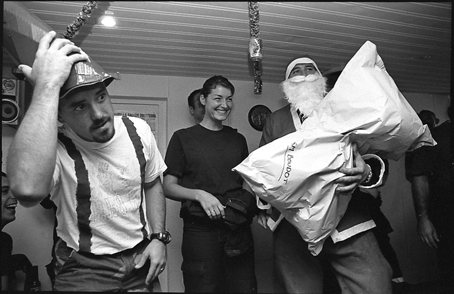 Father Christmas giving a present to Delphine Boudot